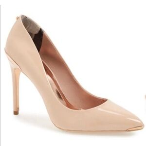 Ted Baker London Kaawin pumps in a nude patent leather finish. READ